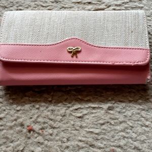 A pink and creme wallet